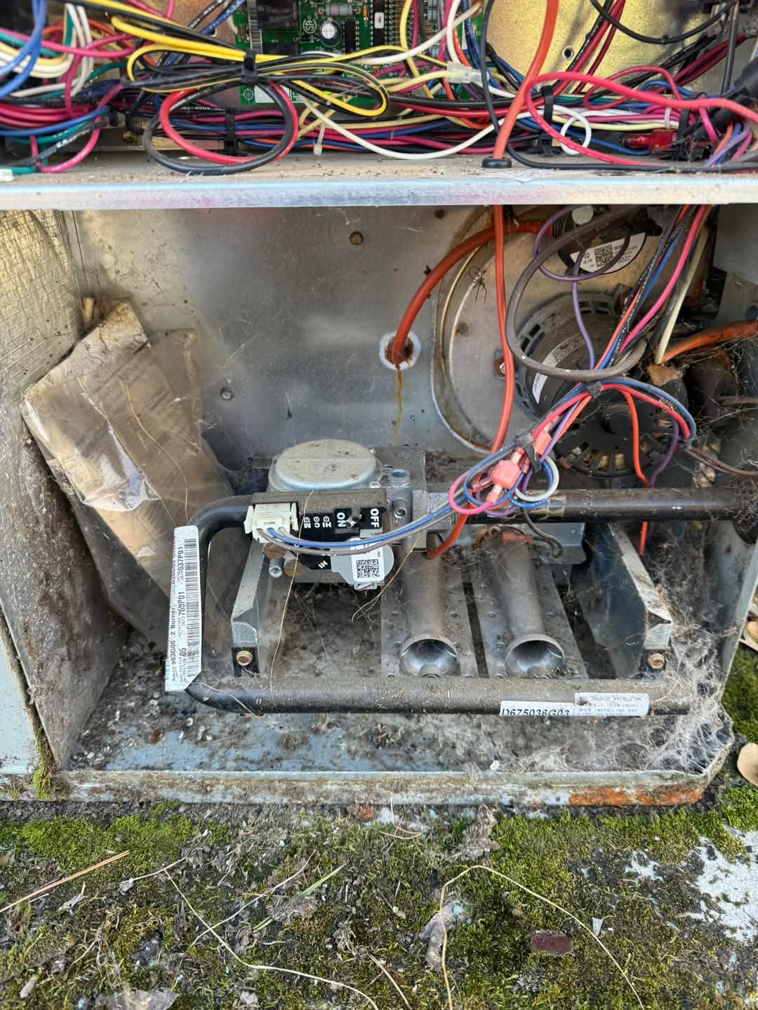 HVAC technician inspecting a residential air conditioning system